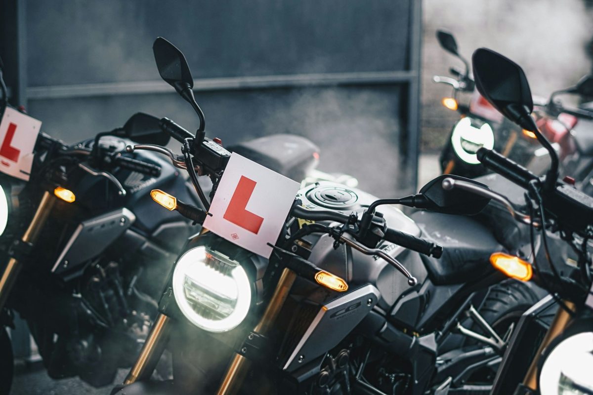 Learner motorcycles lined up with L plates