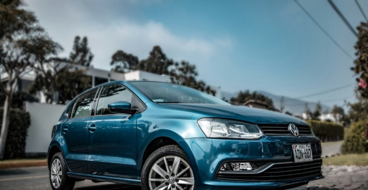 A blue Volkswagen Polo hatchback
